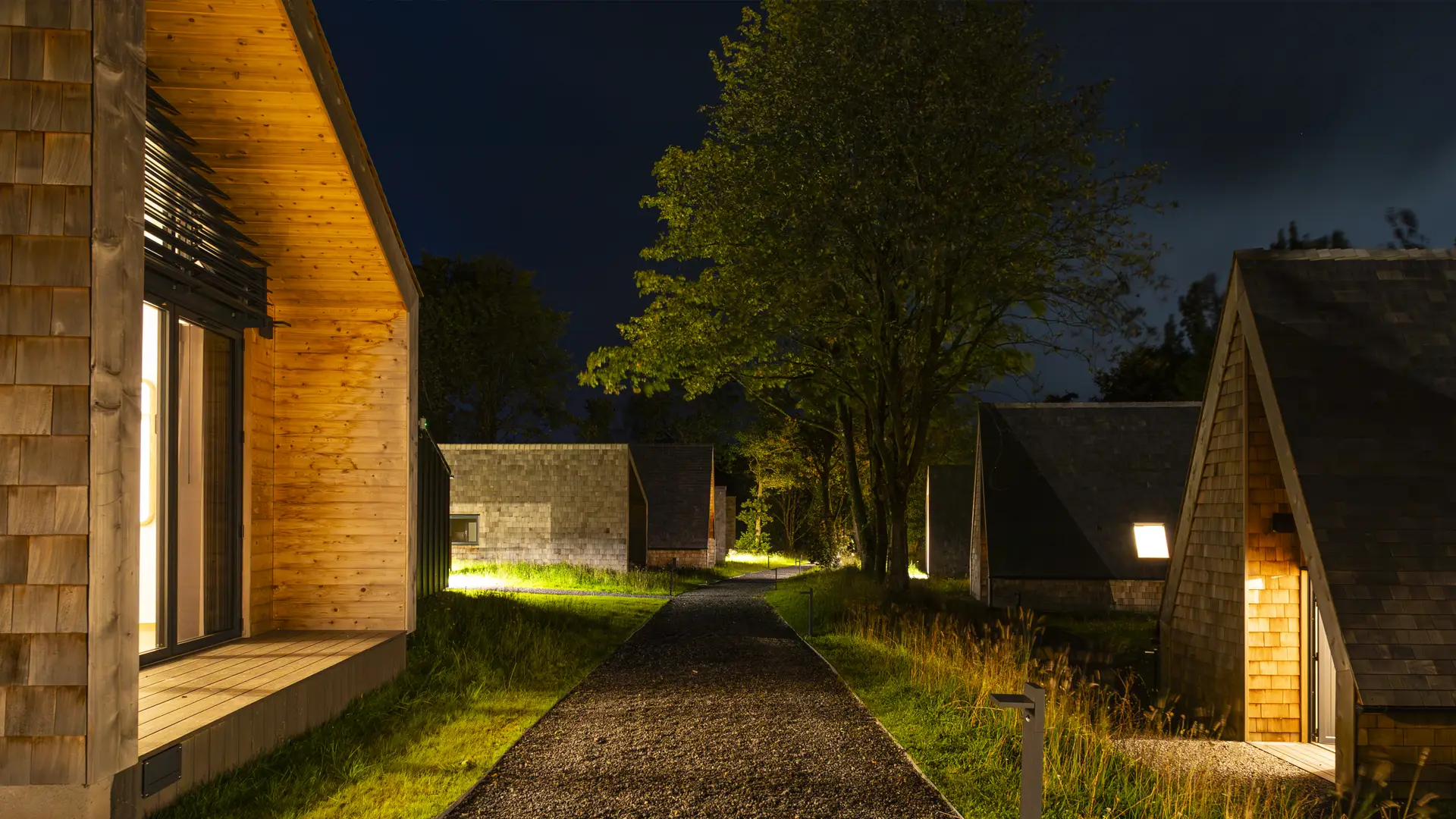 The Halcyon Club - night picture of a cabin exterior